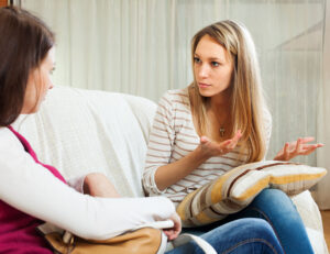 woman telling to friend about her problems